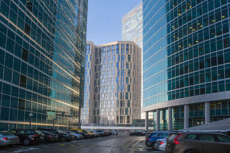 Cars in the parking lot near the modern business centerの写真素材
