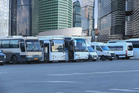 many tourist buses at the bus station in the city
