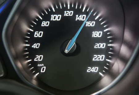 Close up of car speedometer with speed indicating 150 kmの写真素材