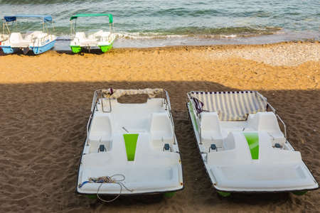 pleasure catamarans on the sea beach in summer