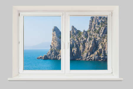 View from the window of the room on a rocky cape in the sea