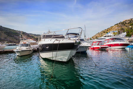 powerboats in the parking lot at the pierの写真素材