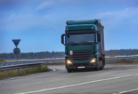big powerful truck moves on highwayの写真素材
