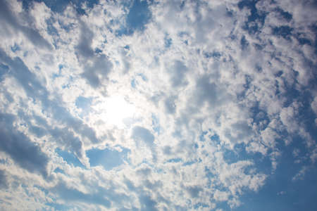 beautiful cloudy sky with bright sunの写真素材