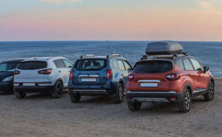 Cars on a sandy beach on a summer