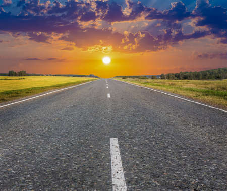 beautiful sunset over the country highwayの写真素材