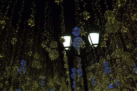 Luminous Christmas night street decoration with luminous electric garlands