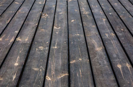 Black pine boards background close-up