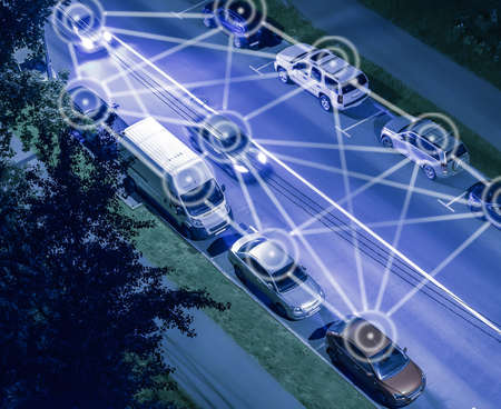 Conceptual interaction of cars on a city street at night. Lane and parking selectionの写真素材