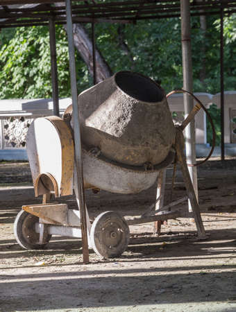 Electric concrete mixer in the yard under a canopyの写真素材
