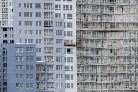 Facade of a new multi-storey residential building under constructionの写真素材
