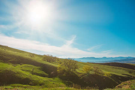 Beautiful landscape with a mountain range in bright sunlight