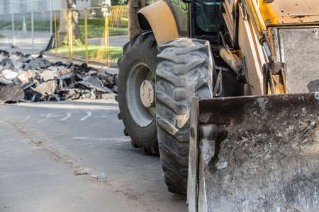 Forklift on the repair of an asphalt roadの写真素材