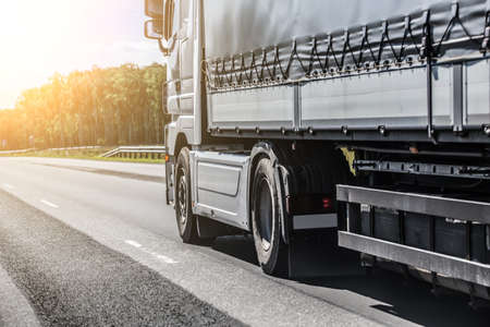 truck transports freight on country highway
