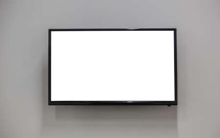 TV on the wall with a white screen. Place for text or image.の写真素材