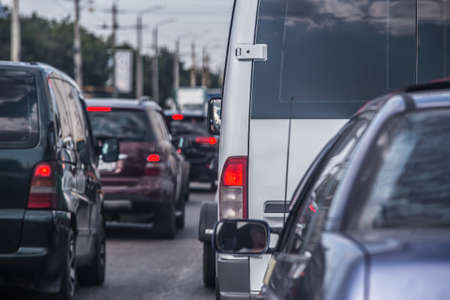 Car in traffic jam. Back view. Blurred background.