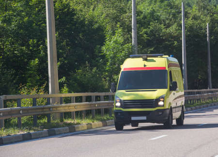 Ambulance on City Street in Summer Dayの写真素材