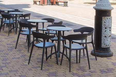 Sidewalk Cafe Without People in the City Center in Summer