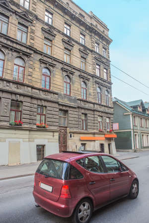 Small Red Car in the Historic City Centerの写真素材