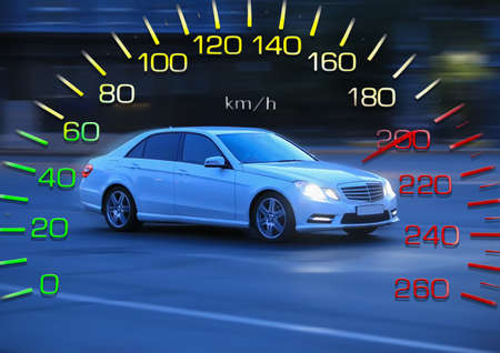 Car rushes through the Night City on the background of the Speedometer. Over speed.の写真素材