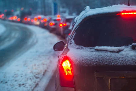 Traffic jam on the Winter Road in Snowfall. Natural cataclysm.の素材 [FY310158541553]