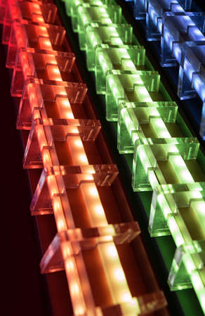 Red Green Blue glowing diode strips in transparent futuristic housingsの写真素材
