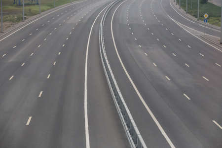 Multi-lane highway with markings on asphalt without cars