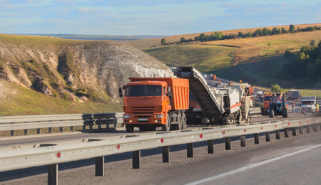 Road equipment on the construction of a highway outside the city