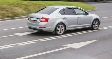 Car are accelerating along the road. Close-up, blurry motion