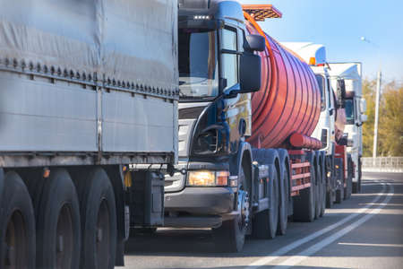Traffic jam on a suburban highway in summerの写真素材