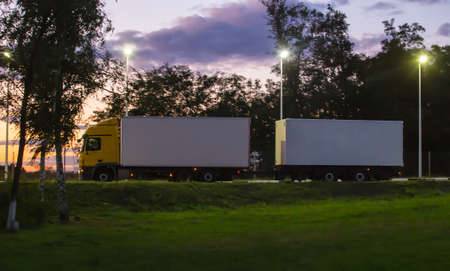 Truck moves on country highway at nightの写真素材