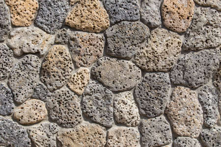 Old brick wall of rough stone background