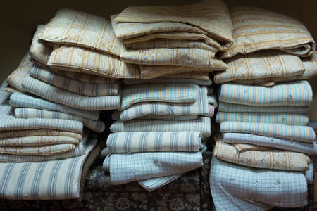 Stacks of old wadded mattresses