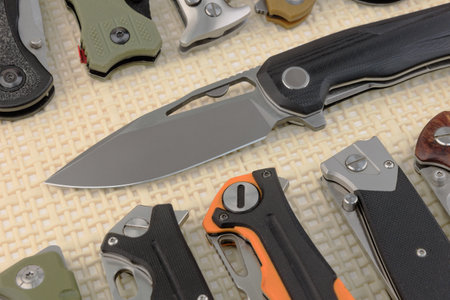 Many different folding knives close-upの写真素材