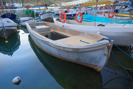 Wooden fishing rowboats moored at the pierの写真素材