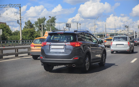 Car traffic on the highway along the bridge in the cityの写真素材