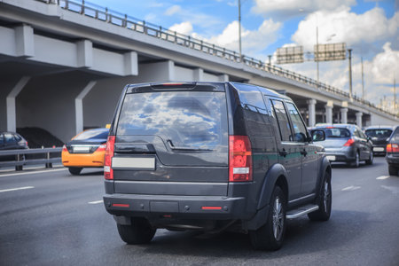 Car traffic on the highway along the bridge in the cityの写真素材