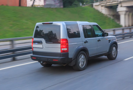 SUV moving on the city street motion blur