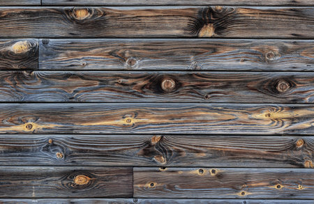 Background old gray boards with knots close-upの写真素材