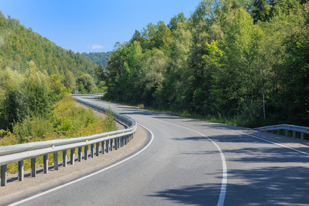 Winding road in the mountains on a summer dayの写真素材