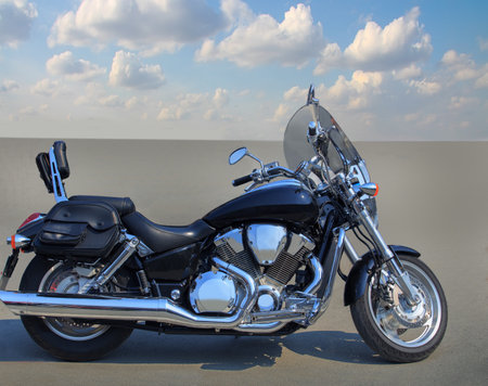 Motorcycle on the asphalt under a cloudy sky close-up side view.の写真素材