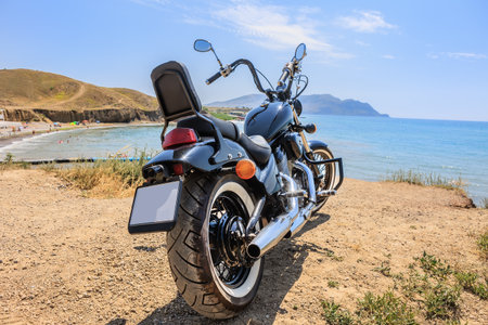 Motorcycle on the seashore near the beach on a bright sunny dayの写真素材