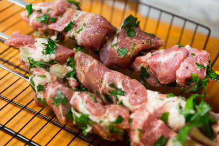 Barbecue skewers with meat, herb and spiceの写真素材