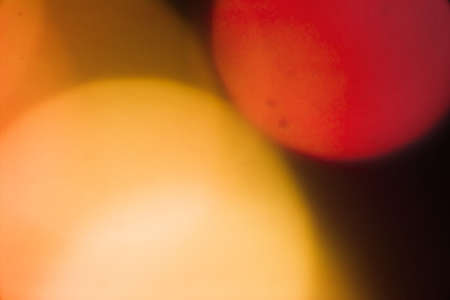 abstract orange bokeh circles backgroundの写真素材
