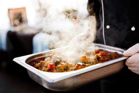 steaming hot stew with meat and vegetablesの写真素材