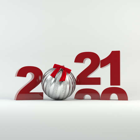 2020-2021 change represents the new year 2021. Silver ball decorated with ribbon. Christmas and New Year 2021 decoration.の写真素材