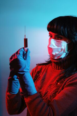 Medicine doctor with medical syringe in hands, A(H1N1)
