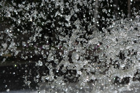 Water splashed against a dark background