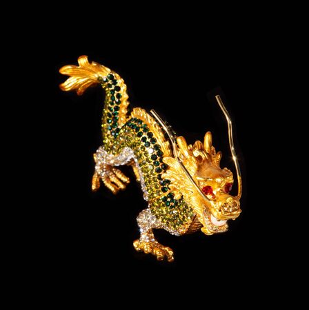 Metal dragon with crystals on the black background (souvenir)の写真素材