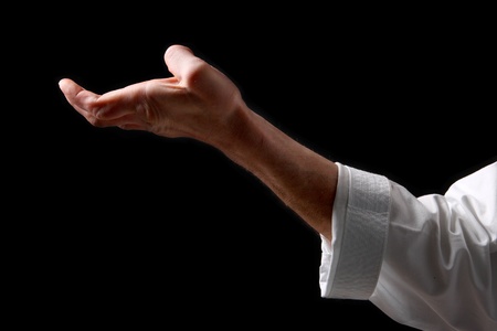 Fist. Hand fighter karate on the black backgroundの写真素材